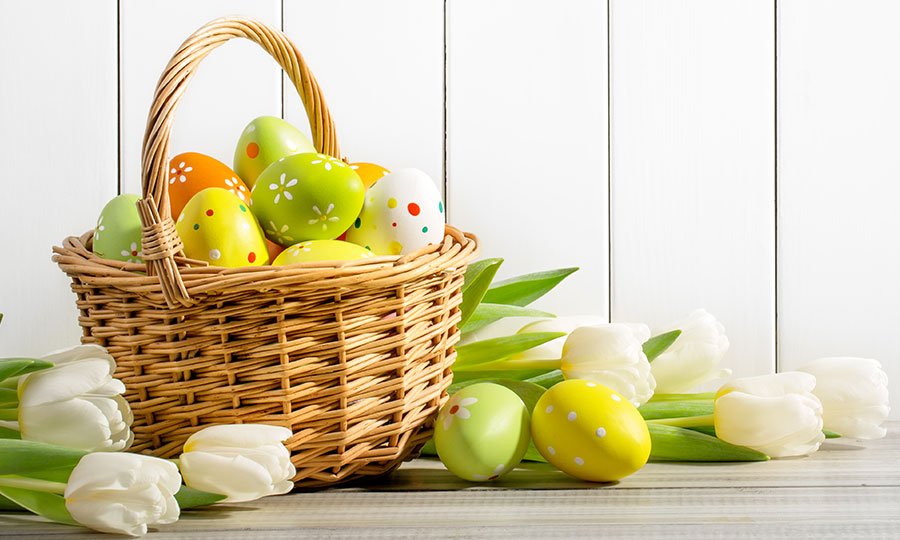 Basket with colourful eggs