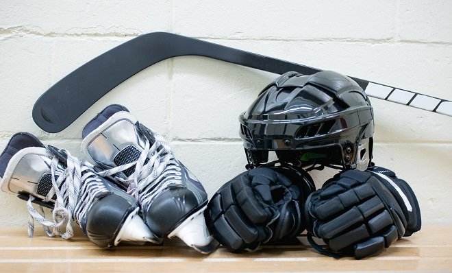 Hockey equipment in a locker room