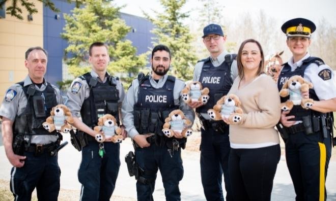 RCMP and Enforcement Services Officers with Victim Services teddys and supervisor