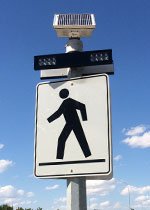 Pedestrian crossing sign with rapid flash beacon