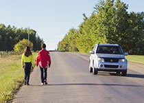 Always wear bright or reflective clothing so drivers can see you.