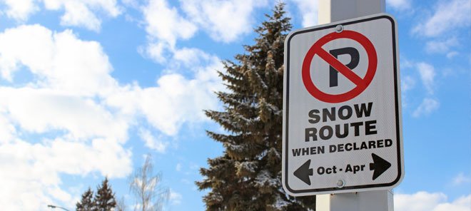 Image showing a snow route clearing sign on a light post
