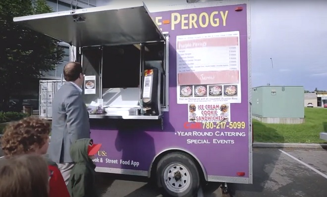 People ordering food from Purple Perogy food truck