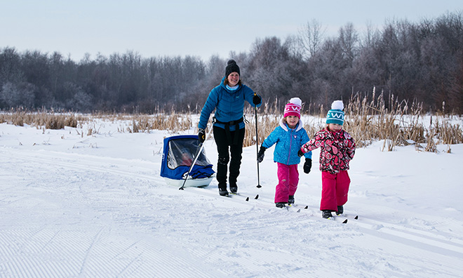 family with cross-country ski equipment