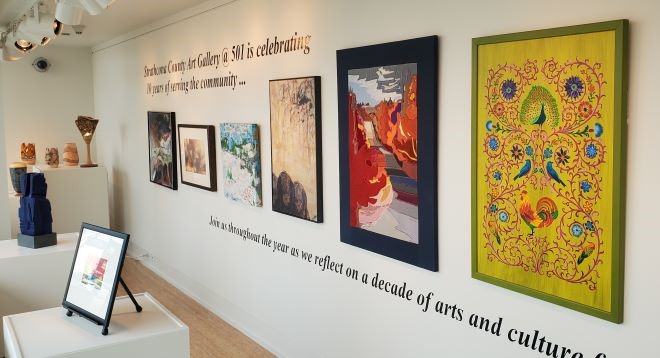A display of artwork from the Strathcona County Art Collection in the Gallery@501 window space. Artwork includes a variety of paintings, sculptures.