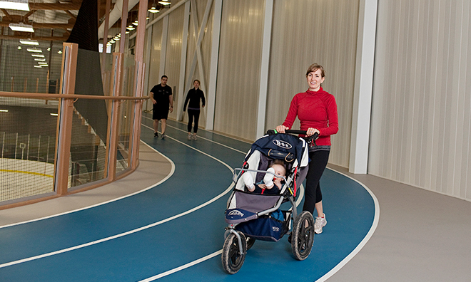 Woman walking on fitness track