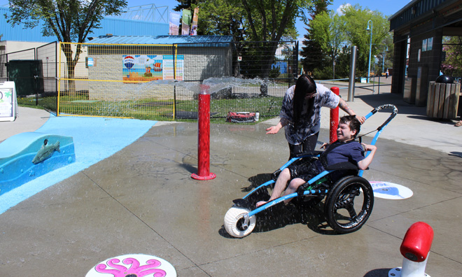 New water wheelchair supports spray park accessibility