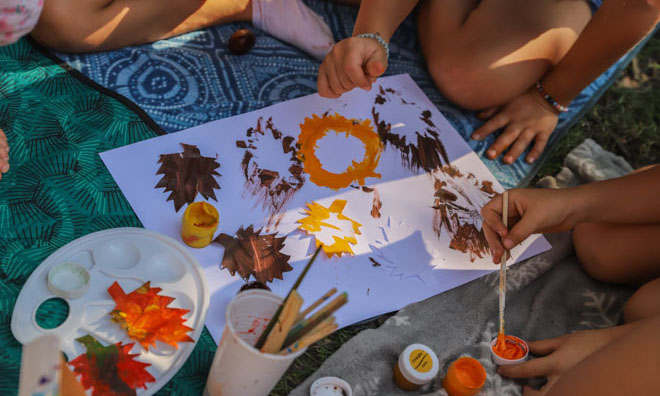 Children painting fall leaves