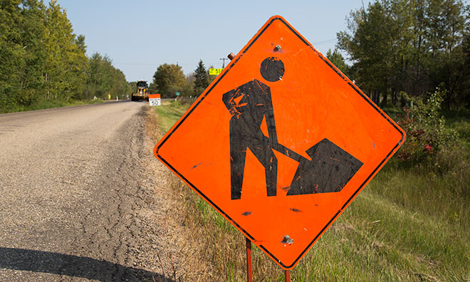 Image of construction sign set up on a rural road