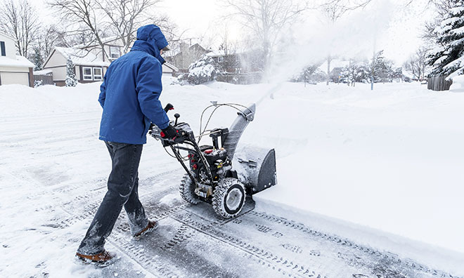 Person clearing snow with a snowblower