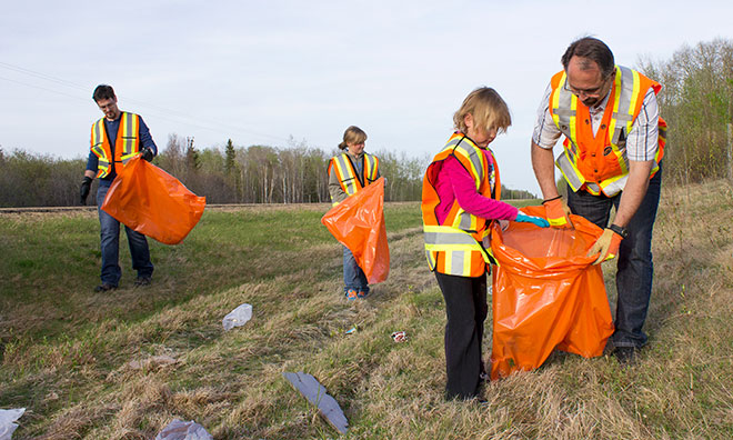 Group of volunteers cleaning up garbage