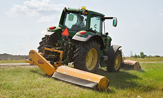 Mower working along the road