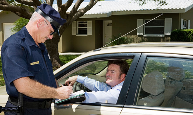 Image of officer giving a speeding ticket