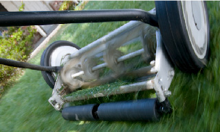 Image of an old reel lawnmower.