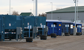 Large bins at recycling station patio
